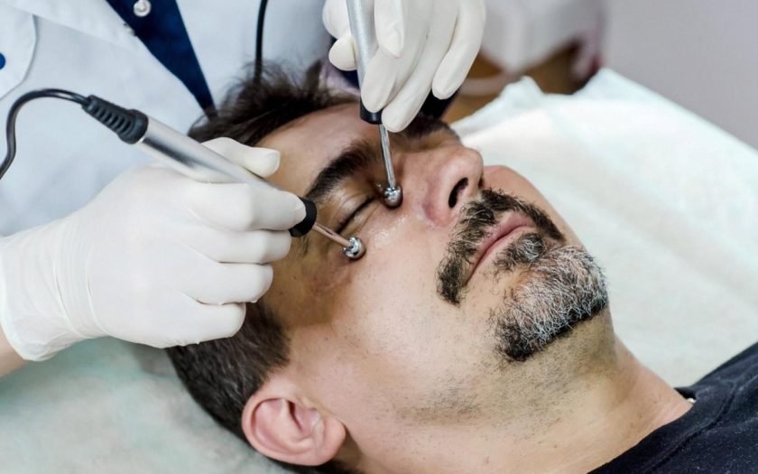 Male patient receiving a facial aesthetic procedure at a UAE clinic
